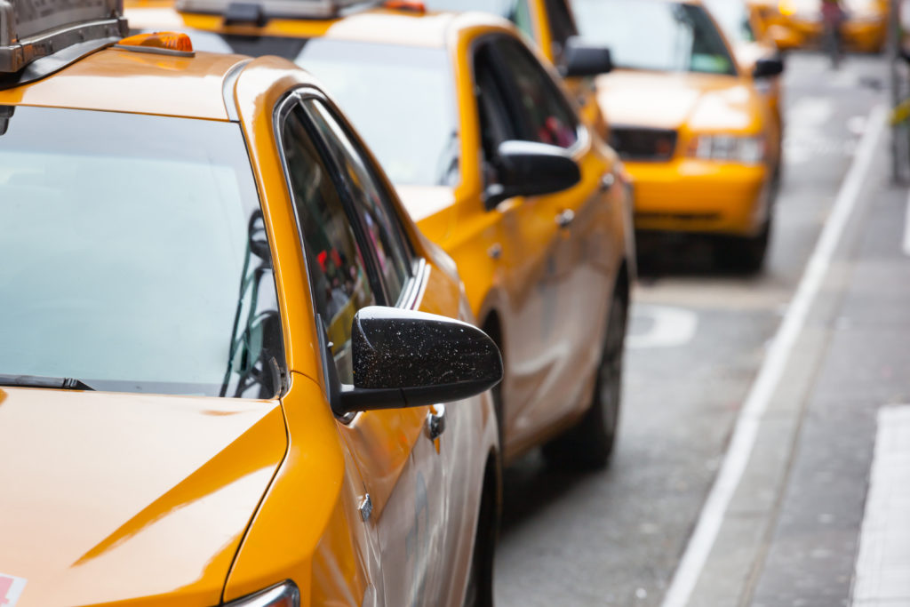 Yellow cabs in a line in Manhattan, NYC.